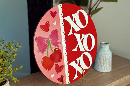 Valentine's Day XOXOXO Door Hanger SVG | Heart-Shaped Cherries with Bow | Laser Cut File with Scalloped Edge | DIY Valentine Decor