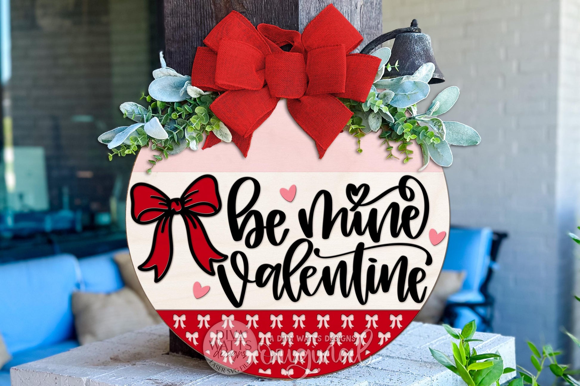 Digital File for a layered round Valentine door hanger design featuring the phrase “Be Mine Valentine,” a bold bow, small hearts, and a sectioned round layout. This SVG is designed for laser cutting on Glowforge, xTool, OMTech, and similar machines. Buyers can cut and assemble their own wooden sign, painting and decorating it with personal colors and materials. Digital design only; no physical greenery, ribbons, or props included. Perfect for DIY porch décor or seasonal craft projects.