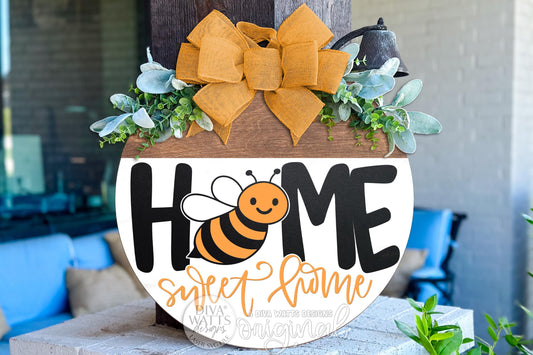 Digital SVG file of a Home Sweet Home round door hanger featuring a smiling honey bee and bold farmhouse-style lettering. This instant download laser cut design is layered and ready for Glowforge, xTool, OMTech, and other laser machines. Ideal for creating a DIY round door hanger, spring or summer porch décor, bee-themed welcome sign, or handmade farmhouse sign. This is a digital file only, allowing makers to cut, paint, and assemble their own custom bee door décor.