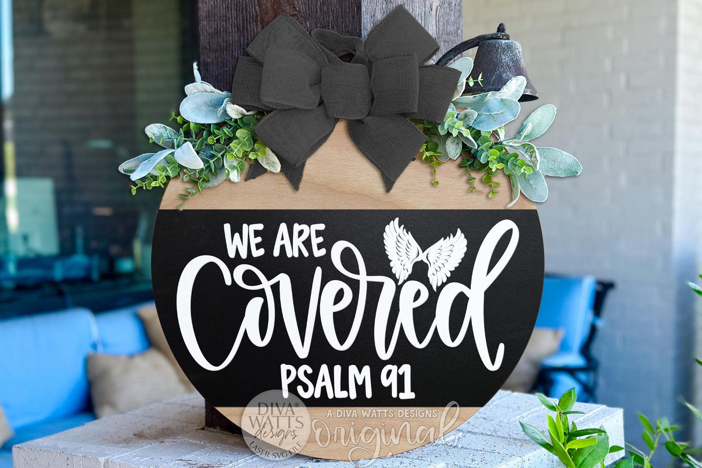 Digital SVG file for a We Are Covered Psalm 91 round door hanger laser cut design with faith-based lettering and angel wing details. This instant download includes a laser-ready SVG and multiple file formats for laser machines. Create your own DIY Christian door hanger, faith porch décor, or scripture sign using this digital file. No physical sign included—this digital laser cut design allows full customization of colors, size, and finish for meaningful home décor.