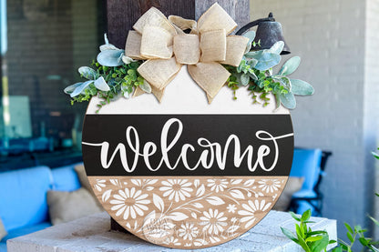Digital SVG file instant download of a round Welcome door hanger laser cut design with layered script text and floral cutout detail. This SVG laser cut file is designed for DIY porch décor and entryway signs. Use this digital file to create your own round door hanger, seasonal sign, or everyday welcome décor using a laser machine. Perfect for makers creating custom wood signs and home décor projects.