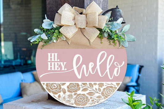 Digital SVG file instant download of a Hi Hey Hello round door hanger laser cut design with layered script text and floral cutout detail. Create your own DIY porch sign, entryway décor, or custom round door hanger using this laser-ready digital file.