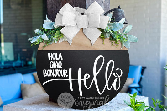Digital SVG file of a Hello Welcome round door hanger design featuring multilingual greetings including Hola, Ciao, Bonjour, and Hello. This instant download laser cut design is professionally layered and ready for Glowforge, xTool, OMTech, and other laser machines. Ideal for creating a modern round door hanger, everyday porch décor, farmhouse entryway sign, or inclusive welcome sign. This is a digital file only, allowing makers to cut, paint, and assemble their own custom welcome door décor.