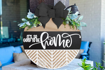 Digital SVG file of a round door hanger laser cut design reading “It’s So Good To Be Home.” This instant download includes layered vector files designed for laser cutting machines, allowing you to create a custom DIY round sign for porch décor or entryway decorating. The digital laser cut design is ideal for painting or staining your own finished sign. No physical product included; this is a flexible SVG digital file for creating a personalized round door hanger.