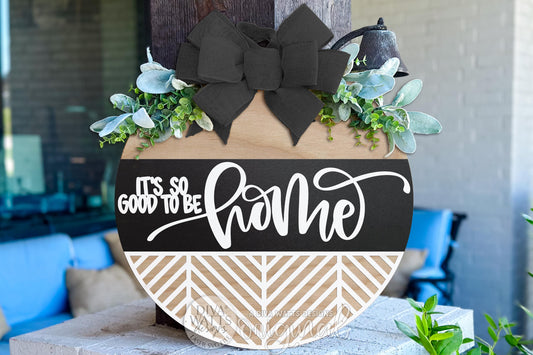 Digital SVG file of a round door hanger laser cut design reading “It’s So Good To Be Home.” This instant download includes layered vector files designed for laser cutting machines, allowing you to create a custom DIY round sign for porch décor or entryway decorating. The digital laser cut design is ideal for painting or staining your own finished sign. No physical product included; this is a flexible SVG digital file for creating a personalized round door hanger.